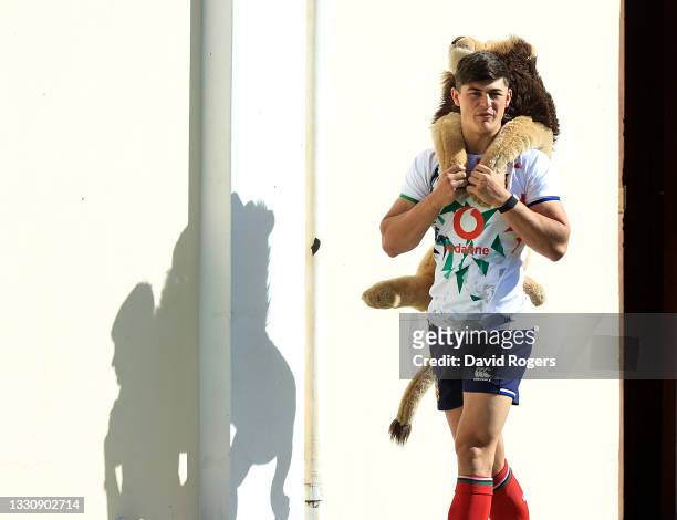 Louis Rees-Zammit, carries the Lions mascot BIL during the British & Irish Lions training session held at Hermanus High School on July 27, 2021 in...