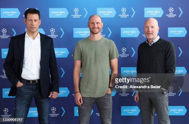 Referee expert Wolfgang Stark, commentator Benedikt Höwedes and expert Matthias Sammer pose during a photo call of Amazon Prime Video at...