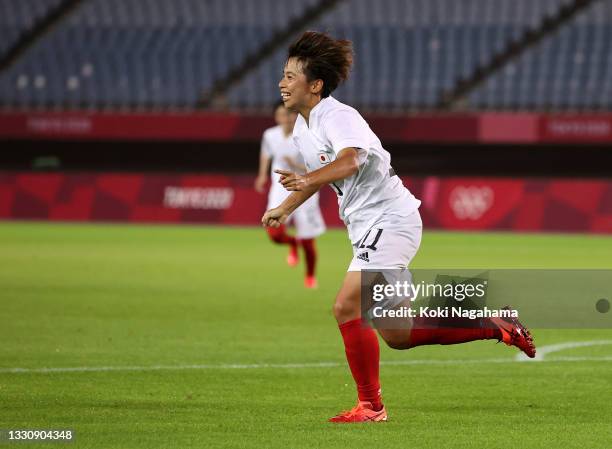 Mina Tanaka of Team Japan celebrates after scoring their side's first goal during the Women's Group E match between Chile and Japan on day four of...