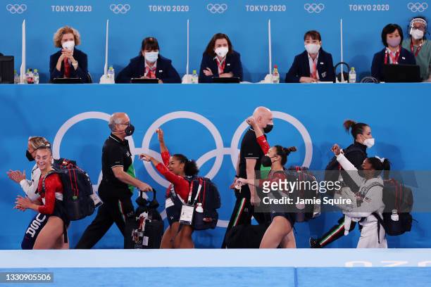 Team United States walks past the judges on the way to floor exercise during the Women's Team Final on day four of the Tokyo 2020 Olympic Games at...