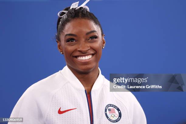 Simone Biles of Team United States smiles during the Women's Team Final on day four of the Tokyo 2020 Olympic Games at Ariake Gymnastics Centre on...