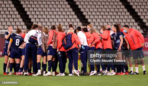 Players of Team Great Britain form a huddle following the Women's Group E match between Canada and Great Britain on day four of the Tokyo 2020...