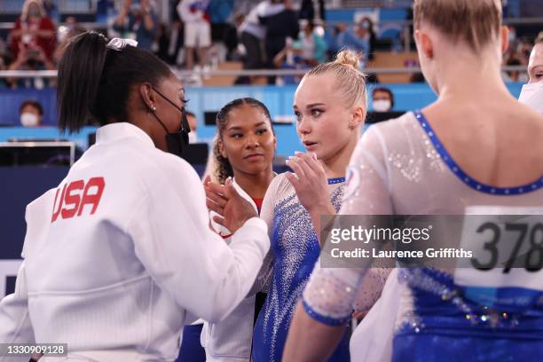 Simone Biles of Team United States congratulates Team ROC on their gold medal win during the Women's Team Final on day four of the Tokyo 2020 Olympic...
