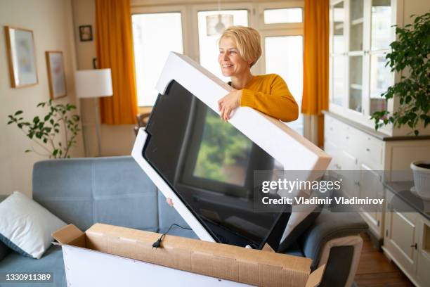 taking delivery of online purchase - new television stock pictures, royalty-free photos & images