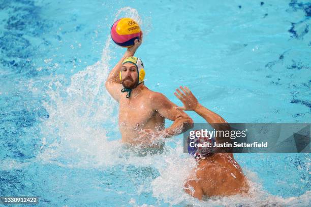 Rhys Howden of Team Australia on attack against Paulo Obradovic of Team Croatia during the Men's Preliminary Round Group B match between Australia...