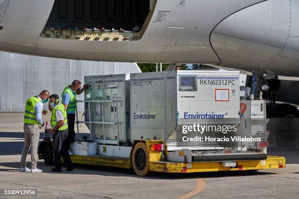 Cargo crew handles two thermal containers unloaded from HA-LHU - Airbus A330-243F - Wizz Air arrived in Figo Maduro Air Force Base to deliver 200...