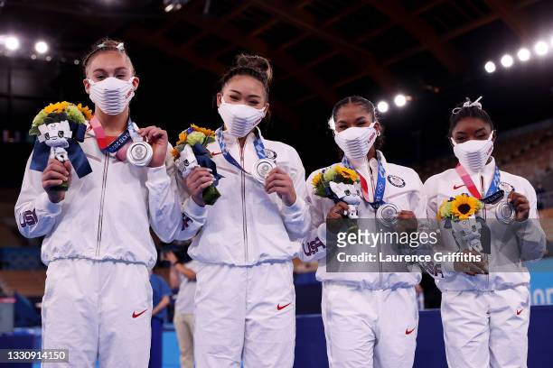 Grace McCallum, Sunisa Lee, Jordan Chiles and Simone Biles of Team United States celebrate after winning the silver medal during the Women's Team...