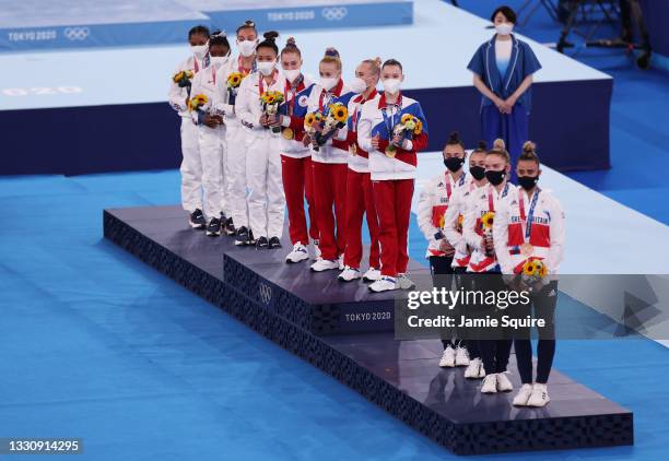 Team United States, Team ROC, and Team Great Britain look on during the medal ceremony after the Women's Team Final on day four of the Tokyo 2020...