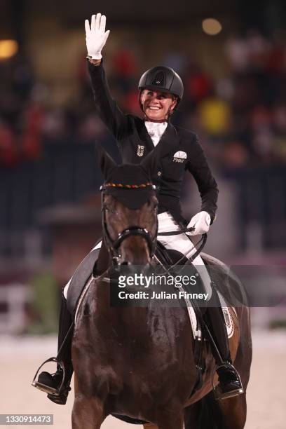 Jessica von Bredow-Werndl of Team Germany riding TSF Dalera celebrates after winning the gold medal in the Dressage Team Grand Prix Special Team...
