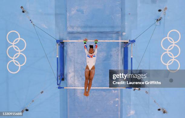 Melanie de Jesus dos Santos of Team France competes in the uneven bars during the Women's Team Final on day four of the Tokyo 2020 Olympic Games at...