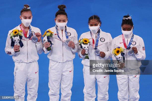 Grace McCallum, Sunisa Lee, Jordan Chiles and Simone Biles of Team United States celebrate after winning the silver medal during the Women's Team...