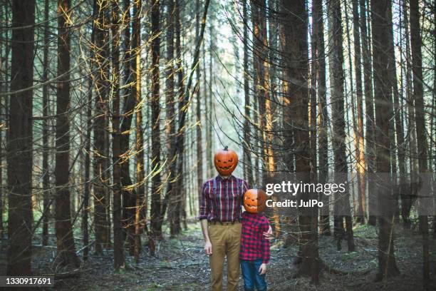 father and son celebrating halloween in forest - dark humor stock pictures, royalty-free photos & images