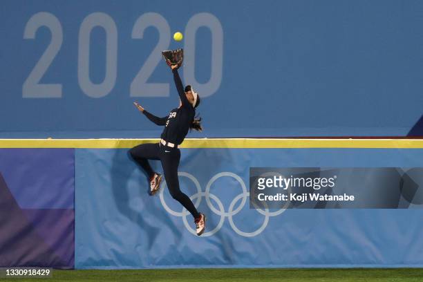 Janette Reed of Team United States makes a catch at the wall in the seventh inning against Team Japan during the Softball Gold Medal Game between...