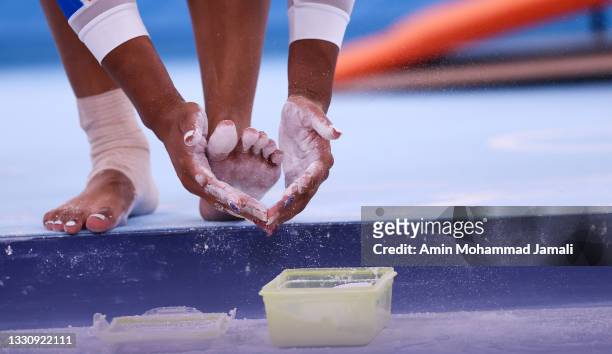 Detail view of Marine Boyer's hands of Team France competes on the balance beam during the Women's Team Final on day four of the Tokyo 2020 Olympic...