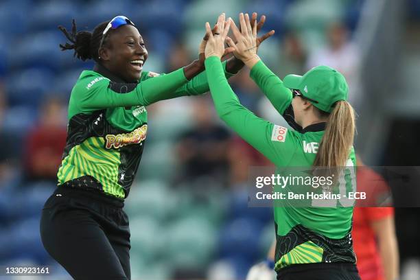 Stafanie Taylor and Amanda-Jade Wellington of Southern Brave celebrate the wicket of Bryony Smith of Welsh Fire during The Hundred match between...