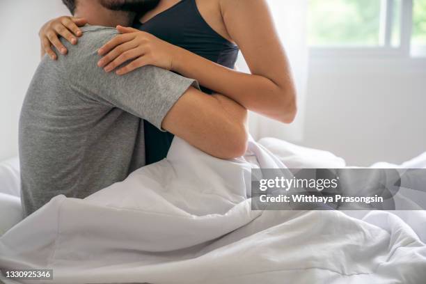 nothing enriches life like love - romantic young couple sleeping in bed stock pictures, royalty-free photos & images