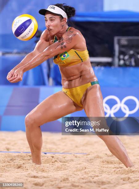 Agatha Bednarczuk of Team Brazil competes against Team China during the Women's Preliminary - Pool C beach volleyball on day four of the Tokyo 2020...