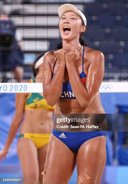 Fan Wang of Team China reacts against Team Brazil during the Women's Preliminary - Pool C beach volleyball on day four of the Tokyo 2020 Olympic...