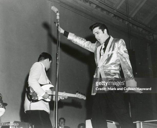 Elvis Presley and Bill Black perform on stage at the Louisiana Hayride, United States, 1956.