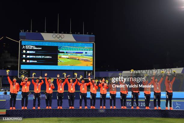 Team Japan receives their gold medals after defeating Team United States 2-0 in the Softball Gold Medal Game between Team Japan and Team United...