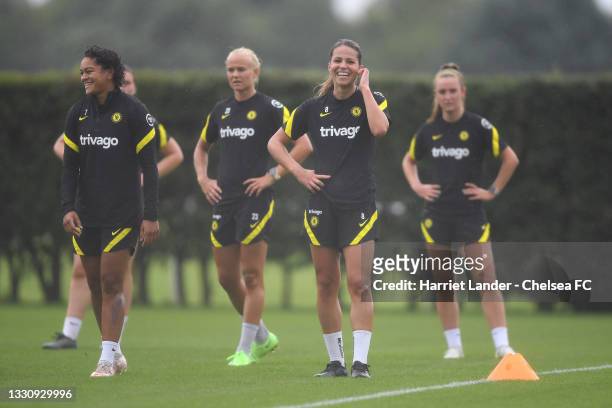 Jess Carter and Melanie Leupolz of Chelsea react during a Chelsea FC Women's Training Session at Chelsea Training Ground on July 27, 2021 in Cobham,...