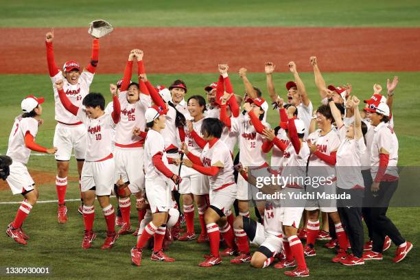 Team Japan celebrates after defeating Team United States 2-0 in the Softball Gold Medal Game between Team Japan and Team United States on day four of...