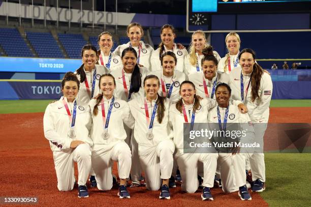 Team United States pose with their silver medals after losing 2-0 to Team Japan in the Softball Gold Medal Game between Team Japan and Team United...