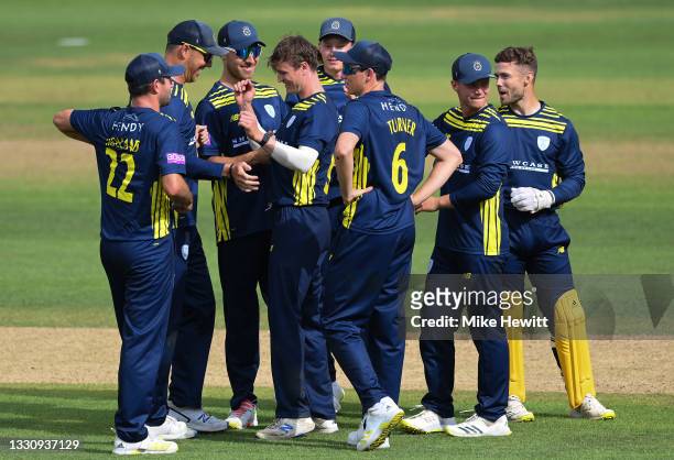 Nick Gubbins of Hampshire celebrates with team mates after dismissing Travis Head of Sussex during the Royal London Cup match between Hampshire and...