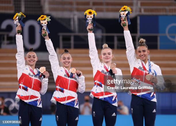 Team Great Britain celebrate on the podium after winning the bronze medal during the Women's Team Final on day four on day four of the Tokyo 2020...