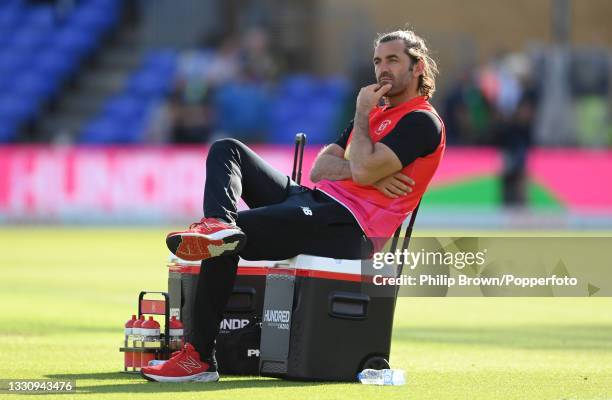 Liam Plunkett of Welsh Fire watches warm up before The Hundred match between Welsh Fire and Southern Brave at Sophia Gardens on July 27, 2021 in...