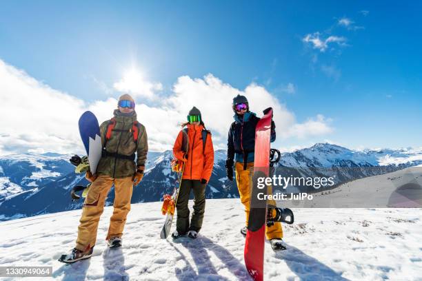 friends in mountains in winter vacation snowboarding - blue sky friends stock pictures, royalty-free photos & images