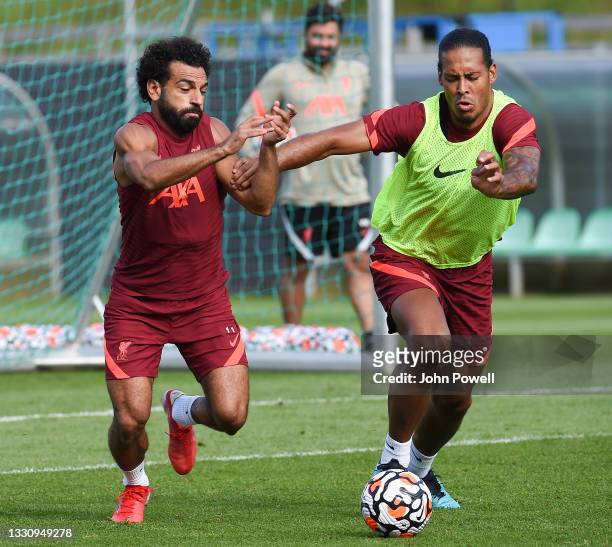 Mohamed Salah of Liverpool with Virgil van Dijk of Liverpool during a training session on July 27, 2021 in UNSPECIFIED, Austria.