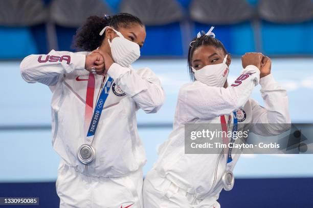 Simone Biles and Jordan Chiles of the United States react after receiving their silver medals during the Team final for Women at Ariake Gymnastics...