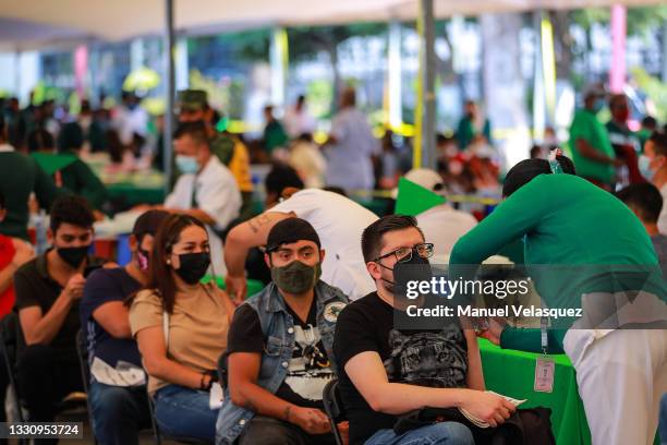 Nurse vaccinates a person at the Covid-19 vaccination center at Centro Cultural Jaime Torres Bodet on July 27, 2021 in Mexico City, Mexico. Third...