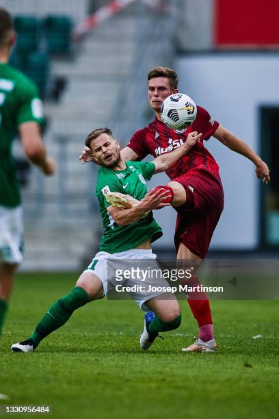 Rauno Sappinen of FC Flora is fouled by Mateusz Holownia of Legia Warszawaz during UEFA Champions League Second Qualifying Round Second Leg match...