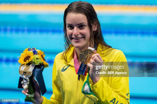 Kaylee Mckeown of Australia shows her gold medal after winning the women 100m Backstroke final during the Tokyo 2020 Olympic Games at the Tokyo...