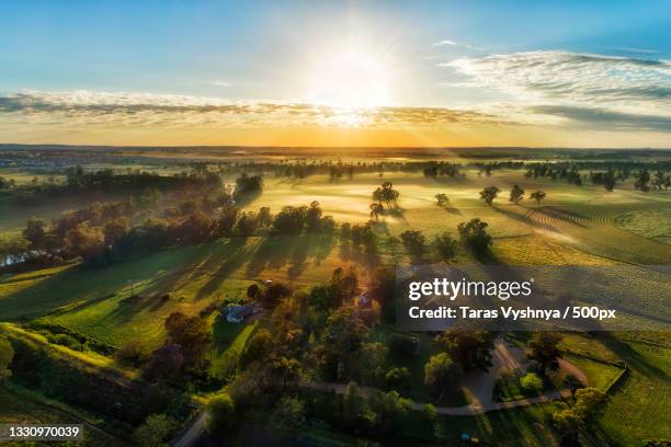 scenic view of field against sky during sunset,dubbo,new south wales,australia - nsw landscape photos et images de collection