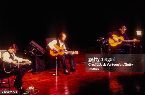 The members of Jazz and World Music group the Guitar Trio perform at Lincoln Center's Avery Fisher Hall, New York, New York, November 20, 1996....