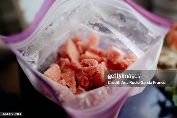 frozen watermelon on a plastic freezer bag - food bag stock pictures, royalty-free photos & images