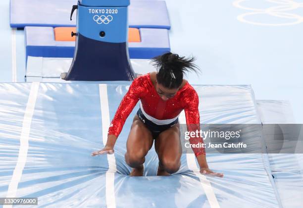 Simone Biles of USA fells before retiring from the event during the gymnastics artistic Women's Team Final on day four of the Tokyo 2020 Olympic...