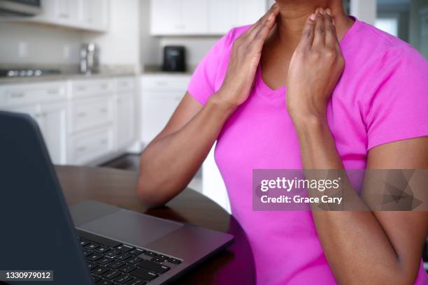 woman experiences neck pain - mobile massage table stock pictures, royalty-free photos & images