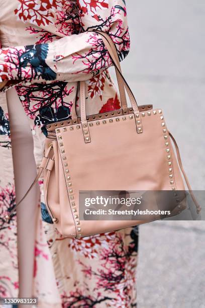 Karin Teigl wearing Prada denim dress and white Hermes Kelly leather  News Photo - Getty Images
