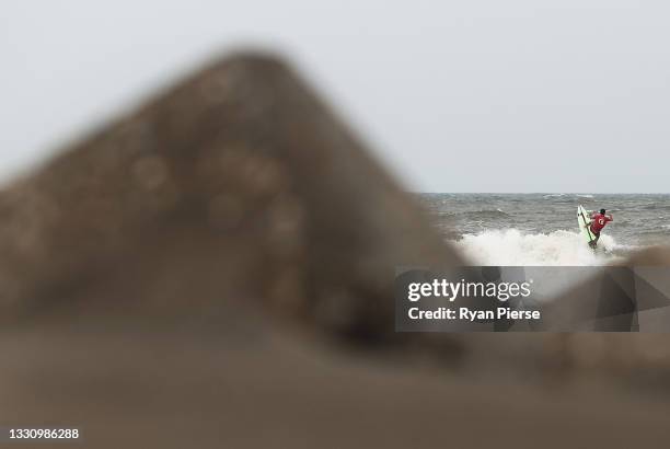 Michel Bourez of Team France surfs during the men's round 3 heat on day three of the Tokyo 2020 Olympic Games at Tsurigasaki Surfing Beach on July...