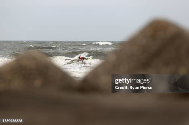 Michel Bourez of Team France surfs during the men's round 3 heat on day three of the Tokyo 2020 Olympic Games at Tsurigasaki Surfing Beach on July...