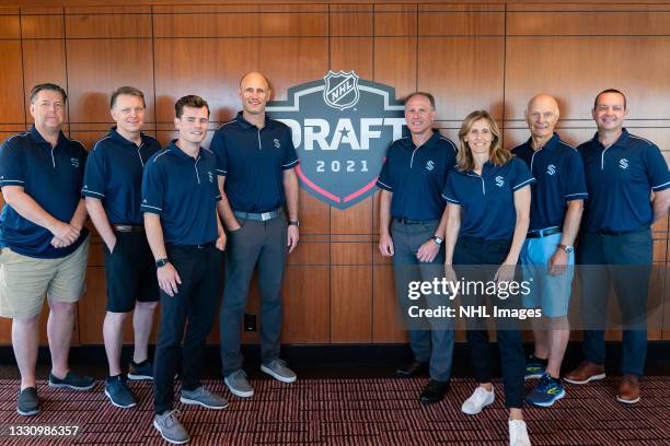 Scouts John Goodwin, Dave Hunter, William White, Andrew Allen, Dave Baseggio, Cammi Granato, Lorne Henning and Stu Barnes of the Seattle Kraken pose...