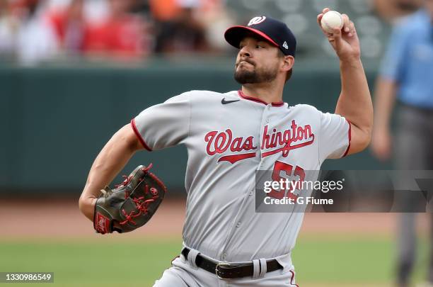 Brad Hand of the Washington Nationals pitches against the Baltimore Orioles at Oriole Park at Camden Yards on July 25, 2021 in Baltimore, Maryland.