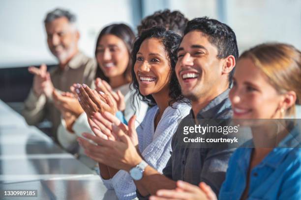 group of business people applauding a presentation. - presentation of paulinho as new player of the pc barcelona stockfoto's en -beelden