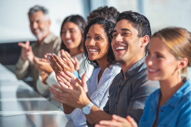 group of business people applauding a presentation. - clapping hands stock pictures, royalty-free photos & images
