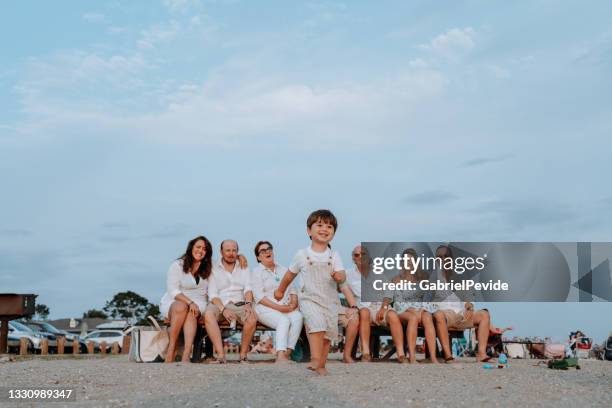 family meeting on the beach - uncle stock pictures, royalty-free photos & images