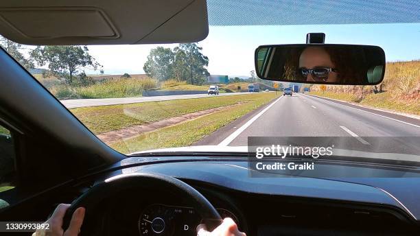 beauty woman driving a car - rear view mirror stock pictures, royalty-free photos & images